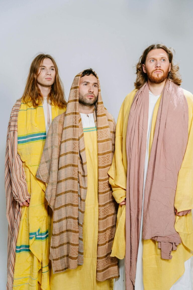 Three men dressed in biblical costumes, representing religious themes.